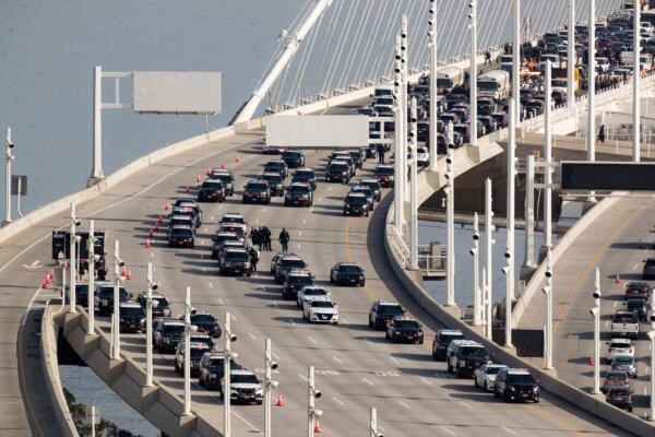 Police respond to protestors who shut down westbound lanes on the eastern span of the Bay Bridge during the Asia-Pacific Economic Cooperation (APEC) summit in San Francisco on Nov. 16, 2023. (Jason Henry/AFP via Getty Images)