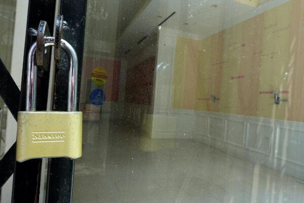 A gate is locked in front of a retail space for lease in San Francisco on June 14, 2023. (Justin Sullivan/Getty Images)