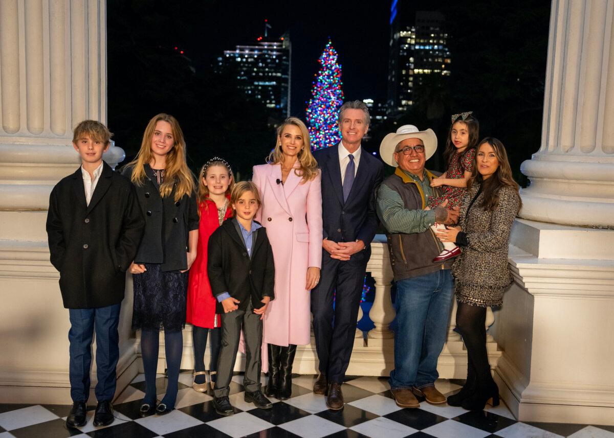 Governor Gavin Newsom and Jennifer Siebel Newsom (C) join family and guests at the annual tree lighting ceremony in Sacramento, Calif., in an event that aired Dec. 6, 2023. (Courtesy of the Office of Governor Gavin Newsom)