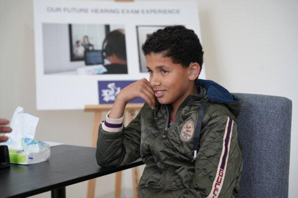 A child wears a new hearing aid. (Courtesy of 3DP4ME)