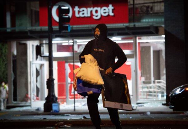 A looter robs a Target store in Oakland, Calif., on May 30, 2020. (Josh Edelson/AFP via Getty Images)