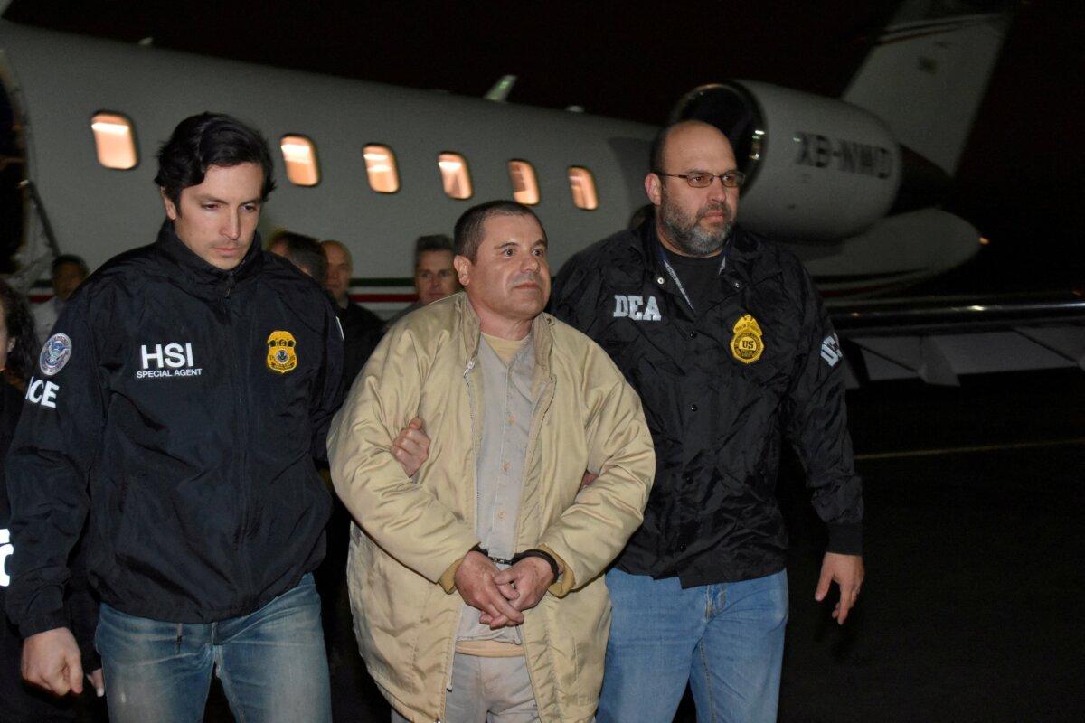 Mexico's top drug lord Joaquin "El Chapo" Guzman is escorted as he arrives at Long Island MacArthur airport in New York on Jan. 19, 2017, after his extradition from Mexico. (U.S. officials/Handout via Reuters)