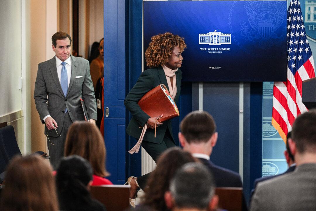 National Security Council spokesman John Kirby (L) and White House press secretary Karine Jean-Pierre arrive for the daily briefing at the White House on Dec. 21, 2023. (Mandel Ngan/AFP via Getty Images)