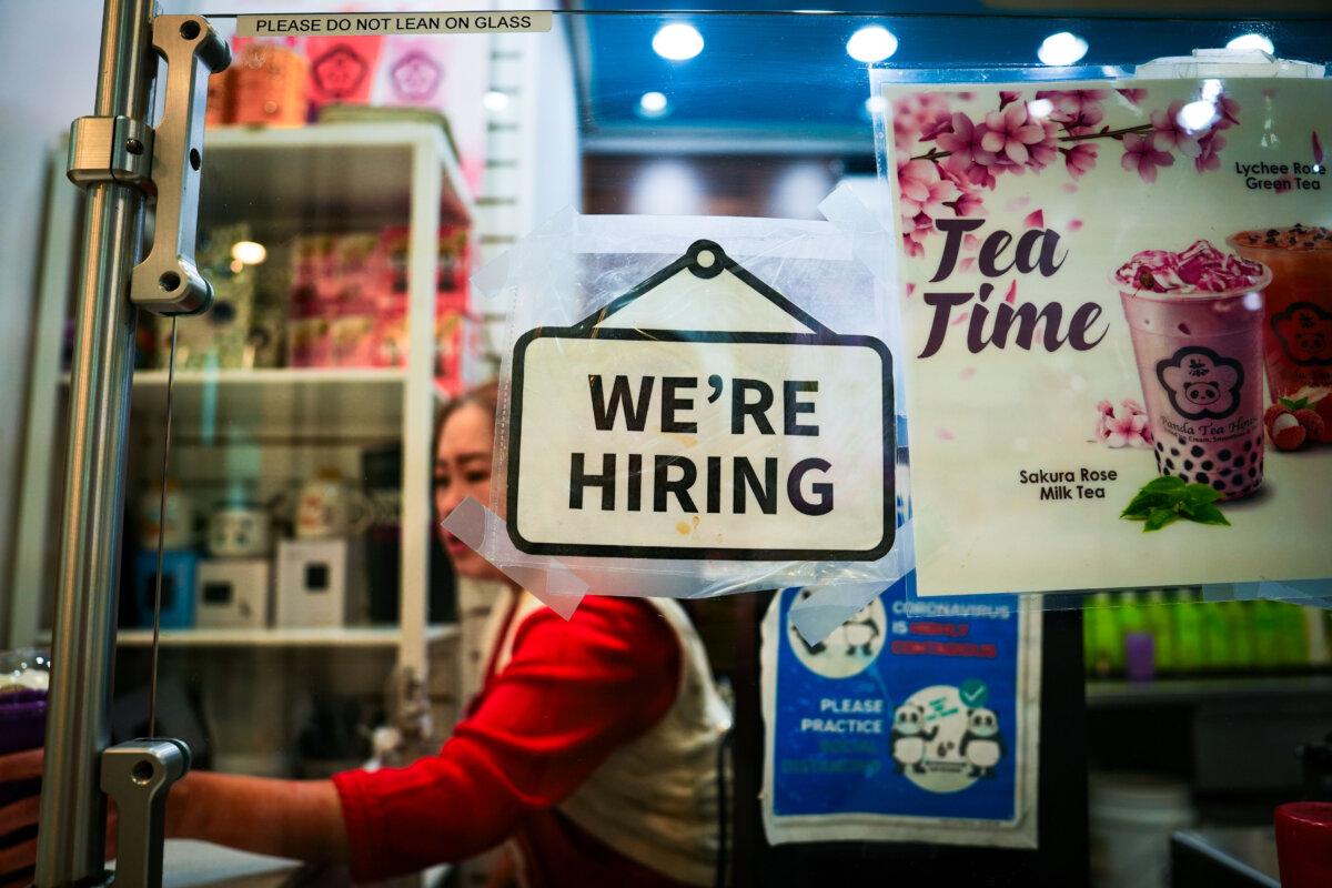 A hiring sign at the Fashion Centre at Pentagon City shopping mall in Arlington, Va., on Jan 3, 2024. (Madalina Vasiliu/The Epoch Times)