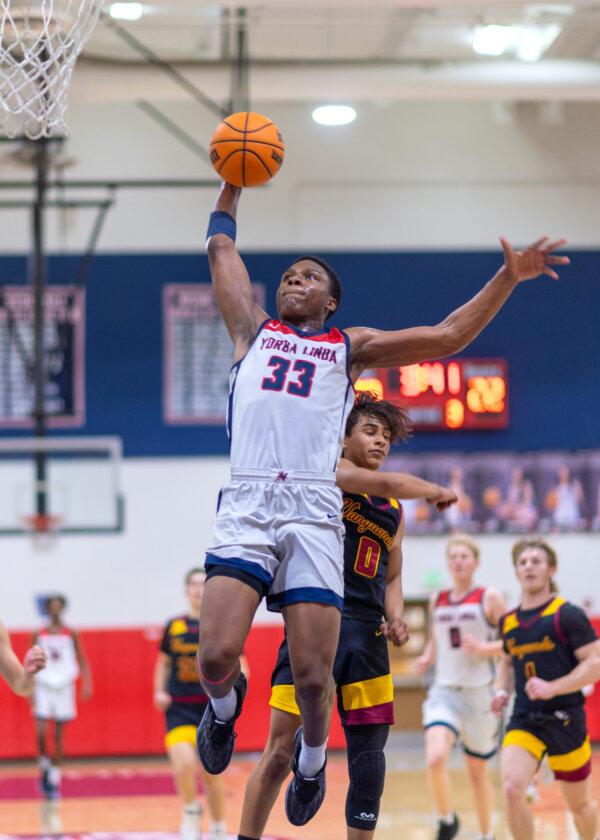 Yorba Linda High School basketball player Jordan Laws (33) shoots the ball at a recent game. (Courtesy of Phil Mangiaracina)