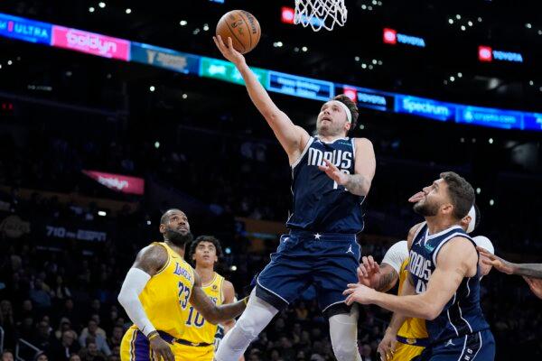 Dallas Mavericks guard Luka Doncic drives to the basket past Los Angeles Lakers forward LeBron James (23) during the first half of an NBA basketball game in Los Angeles on Jan. 17, 2024. (Marcio Jose Sanchez/AP Photo)