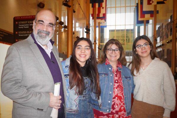 Marcos Peralta with his wife, Fabiana Peralta, and their twin granddaughters at the Kennedy Center Opera House in Washington, D.C., on Jan. 27, 2024. (Sherry Dong/The Epoch Times)