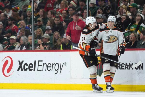 Anaheim Ducks right wing Troy Terry (R) celebrates with center Leo Carlsson (91) after scoring during the third period of an NHL hockey game against the Minnesota Wild, in St. Paul, Minn., on Jan. 27, 2024. (Abbie Parr/AP Photo)