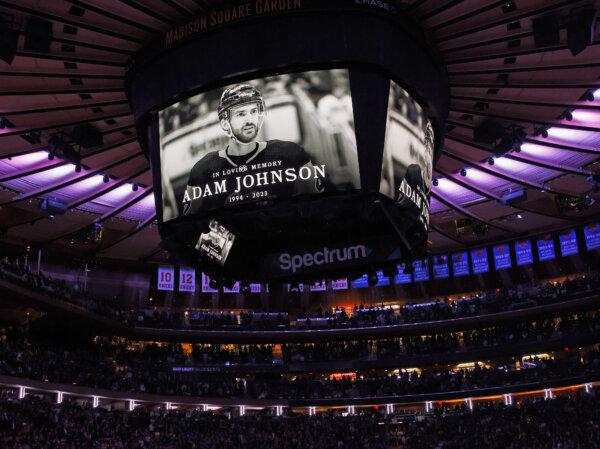 The New York Rangers and the Carolina Hurricanes hold a moment of silence for Adam Johnson prior to their game at Madison Square Garden in New York City on Nov. 2, 2023. (Bruce Bennett/Getty Images)