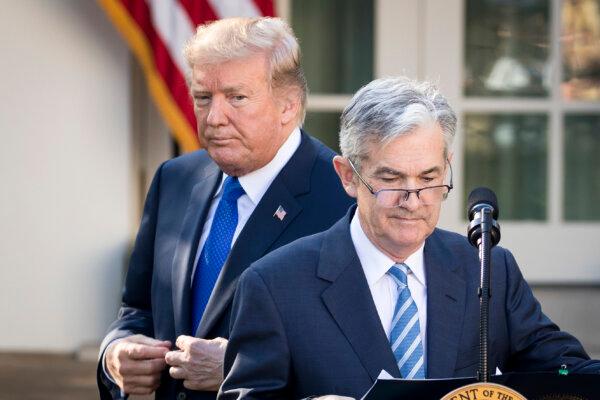 President Donald Trump (L) looks on as his nominee for chairman of the Federal Reserve, Jerome Powell, takes to the podium during a press event in the Rose Garden at the White House on Nov. 2, 2017. (Photo by Drew Angerer/Getty Images)