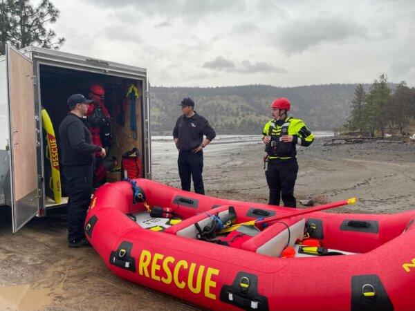 Volunteers attempt to rescue two deer that were stuck in mud in Copco Lake, Calif., on Jan. 27, 2024, after officials began draining the lake as part of a process to remove two dams. (Courtesy of Hornbrook Fire Protection District)