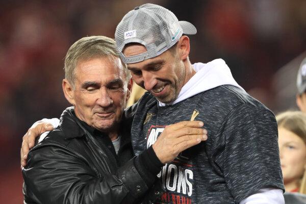 Head coach Kyle Shanahan of the San Francisco 49ers celebrates with his father, Mike Shanahan, after winning the NFC Championship game against the Green Bay Packers at Levi's Stadium in Santa Clara, Calif., on Jan. 19, 2020. (Sean M. Haffey/Getty Images)