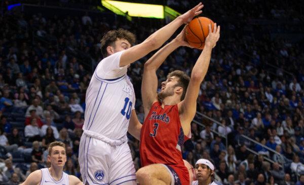 Tredyn Christensen (10) of the Brigham Young Cougars pressures Augustus Marciulionis (3) of the Saint Marys Gaels during the first half of their game at the Marriott Center in Provo, Utah, on Jan. 28, 2023. (Chris Gardner/Getty Images)