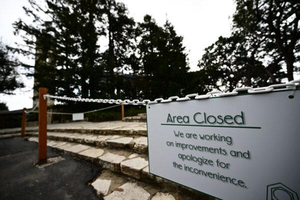 A sign is displayed outside Wayfarers Chapel following its closure in Rancho Palos Verdes, Calif., on Feb. 16. (Patrick T. Fallon/AFP via Getty Images)