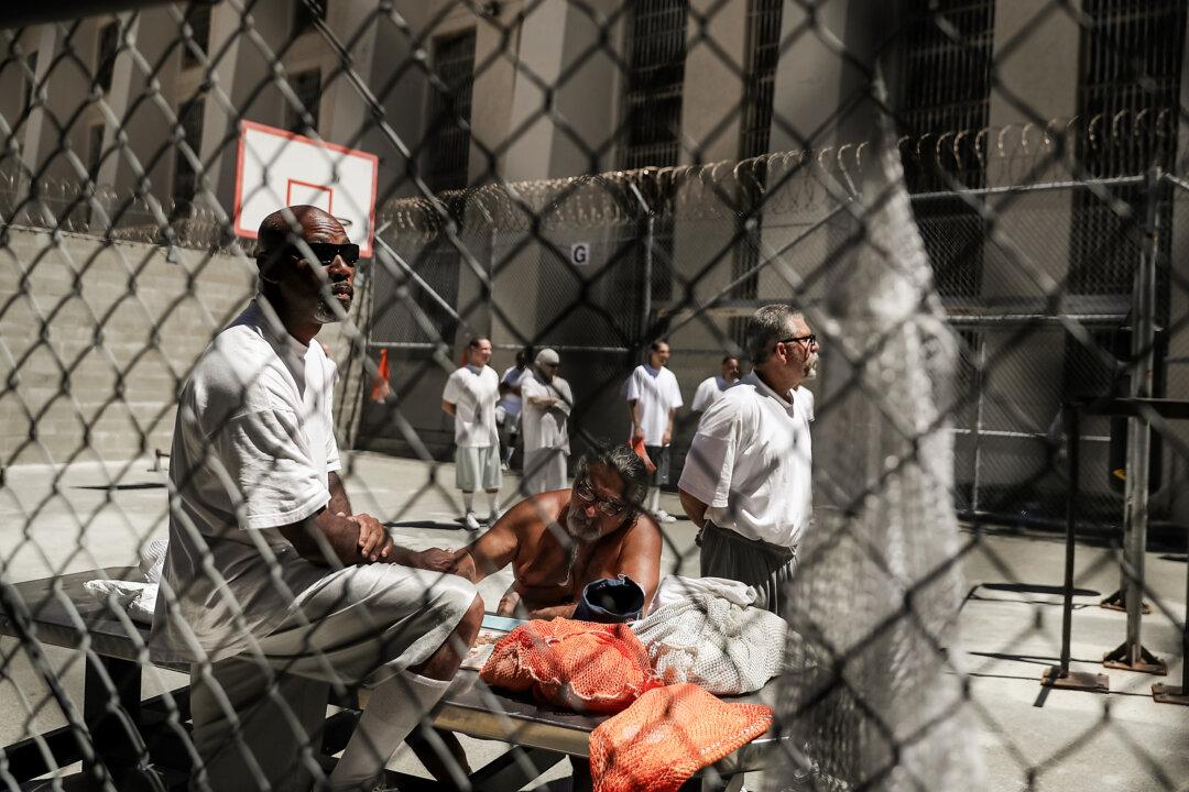 Condemned inmates stand in an exercise yard at San Quentin State Prison's death row in San Quentin, Calif., on Aug. 15, 2016. San Quentin opened in 1852 and is California's oldest penitentiary. (Justin Sullivan/Getty Images)