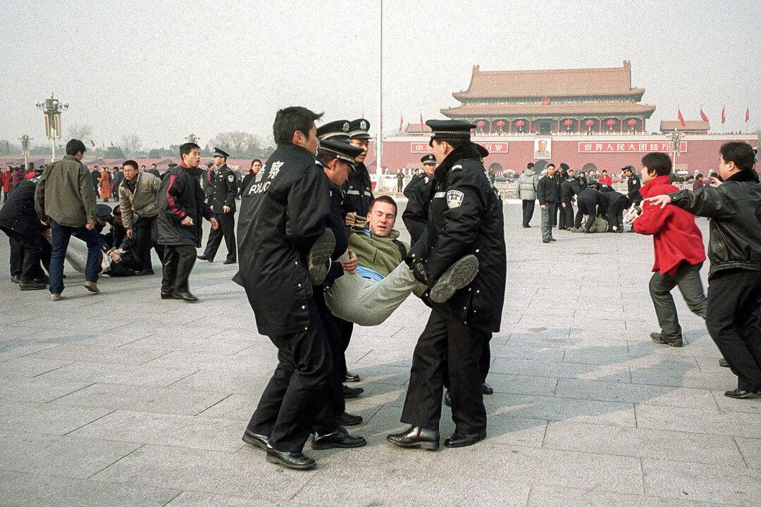 (Left) Police officers tackle and arrest Falun Gong practioners on Tiananmen Square on Feb. 14, 2002. (Right) A lone Chinese man blocks a line of tanks heading east on Beijing’s Avenue of Eternal Peace during the Tiananmen Square massacre on June 5, 1989. (Frederic Brown/AFP via Getty Images, Jeff Widener/AP Photo)