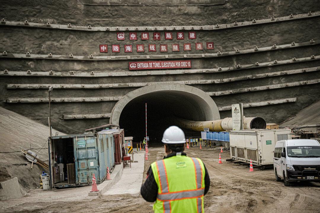 A worker stands near the entrance of a tunnel at the site where Chinese company Cosco Shipping is building a port in Chancay, some 50 miles north of Lima, on Aug. 22, 2023. (Ernesto Benavides/AFP via Getty Images)