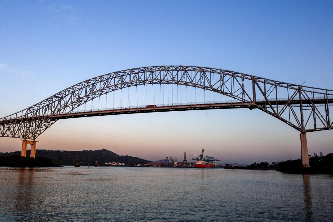 (Top) A ship is guided through the locks in the Panama Canal on Feb. 21, 2024. (Bottom) Traffic crosses the Bridge of The Americas on the Pan-American Highway as an eastbound ship enters the Panama Canal on Feb. 21, 2024. (Bobby Sanchez for The Epoch Times)