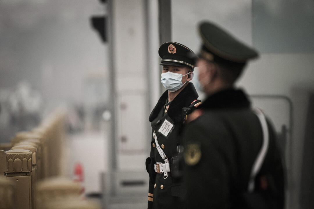 Paramilitary police stand guard on Tiananmen Square in Beijing on March 10, 2021. (Noel Celis/AFP via Getty Images)