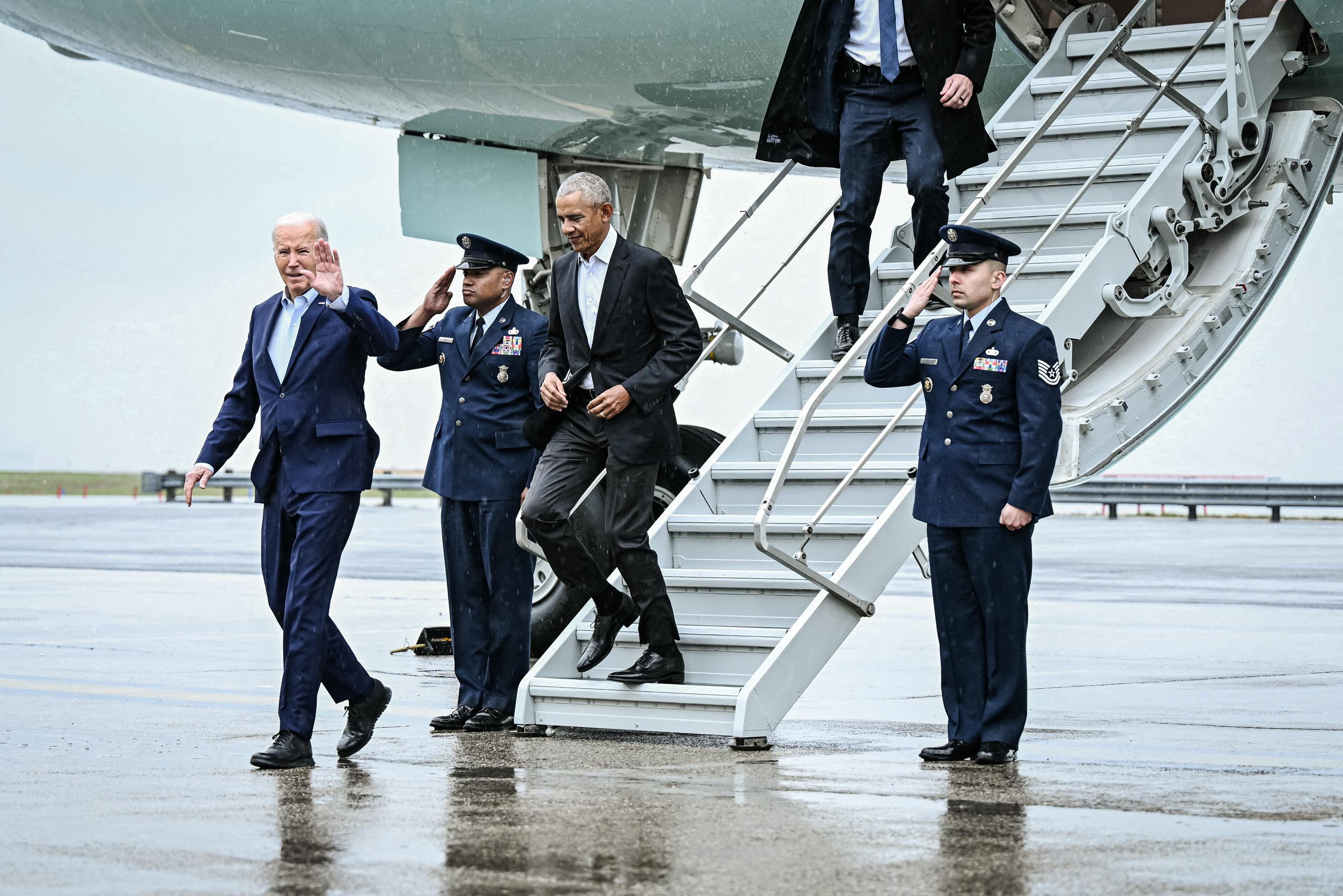 President Joe Biden and former President Barack Obama step off Air Force One upon arrival at John F. Kennedy International Airport in New York City on March 28, 2024. (Brendan Smialowski/AFP via Getty Images)