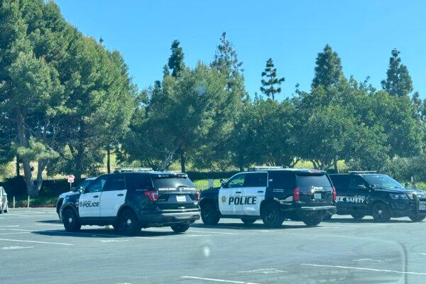 Officers from Costa Mesa and UCI Police departments standing by on campus at a pro-Palestinian protest on April 29, 2024. (Rudy Blalock/The Epoch Times)