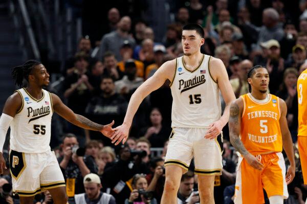 Purdue center Zach Edey (15) greets teammate Lance Jones after an NCAA Tournament Elite Eight game against Tennessee in Detroit on March 31, 2024. (Duane Burleson/AP Photo)