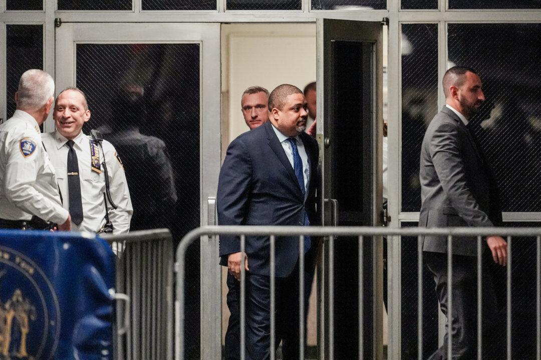 Manhattan district attorney Alvin Bragg (C) returns to court for a pre-trial hearing in a hush money case for former President Donald Trump in criminal court in New York City on March 25, 2024. (Mary Altaffer-Pool/Getty Images)