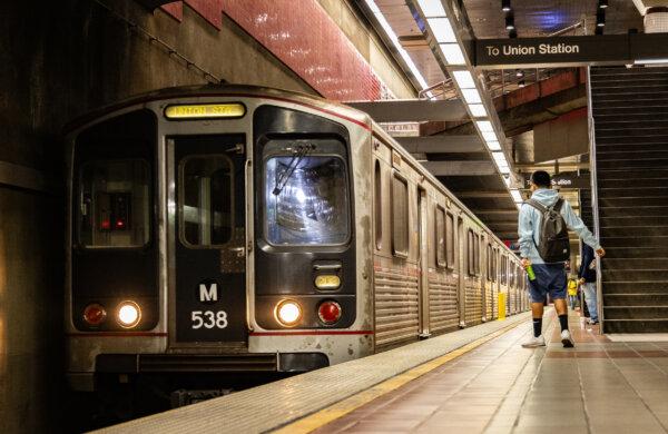 Riders await an LA Metro rail train in Los Angeles on April 10, 2024. (John Fredricks/The Epoch Times)
