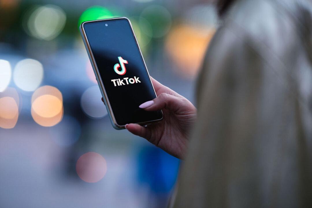 (Left) A receptionist works in the ByteDance office in Shanghai on June 27, 2023. (Right) A woman holds a phone displaying the TikTok app. (Pedro Pardo/AFP via Getty Images, Oleksii Pydsosonnii/The Epoch Times)