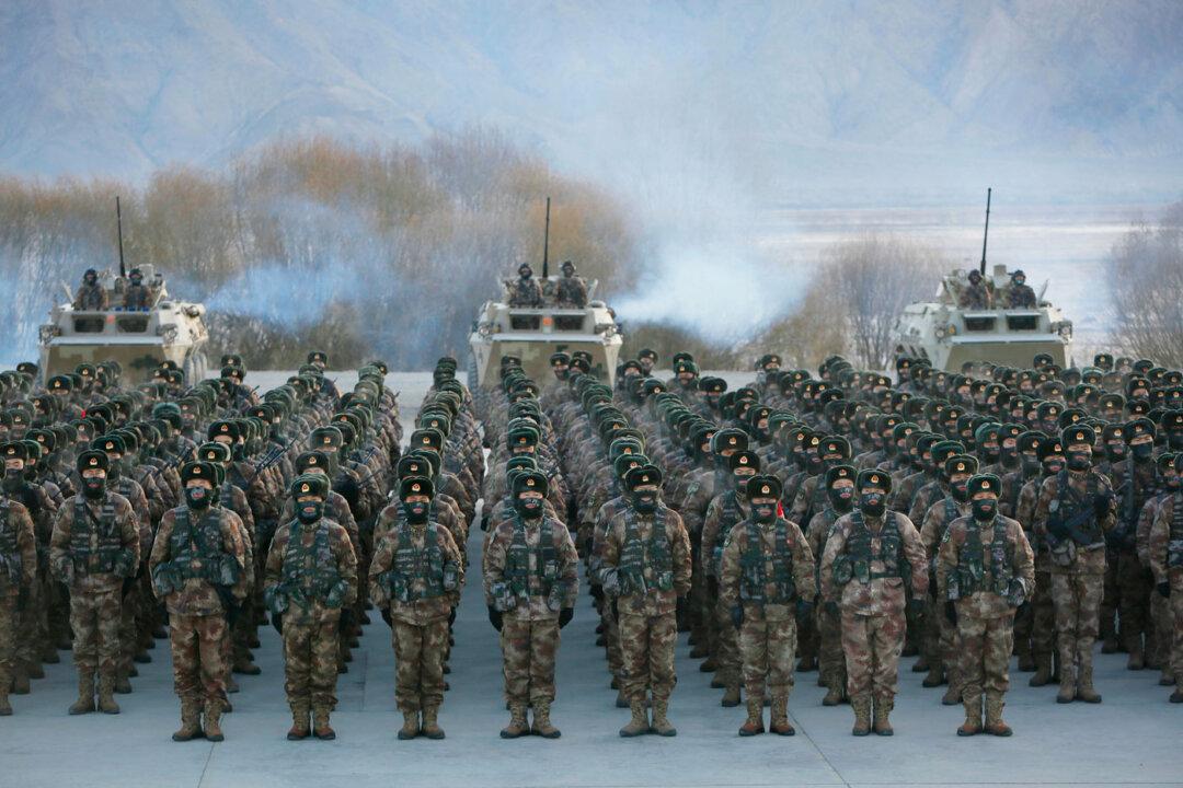 Chinese People's Liberation Army soldiers assemble during military training in northwestern China's Xinjiang region, on Jan. 4, 2021. (STR/AFP via Getty Images)