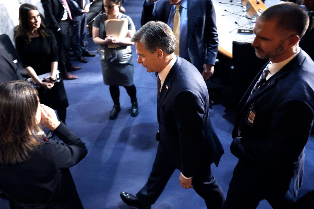 FBI Director Christopher Wray (C) heads into a closed briefing at the U.S. Capitol on March 11, 2024. (Chip Somodevilla/Getty Images)