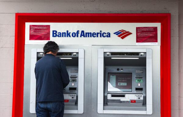 A Bank of America customer uses an ATM at a branch office in San Francisconon July 14, 2021. (Justin Sullivan/Getty Images)