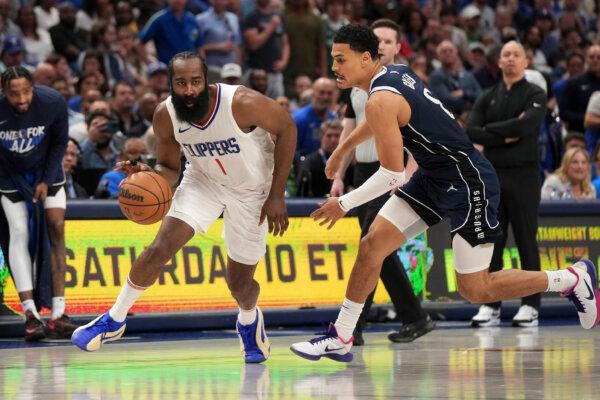 The Clippers' James Harden drives past Josh Green of the Mavericks during NBA playoff action in Dallas on April 28, 2024. (Jeffrey McWhorter/AP Photo)