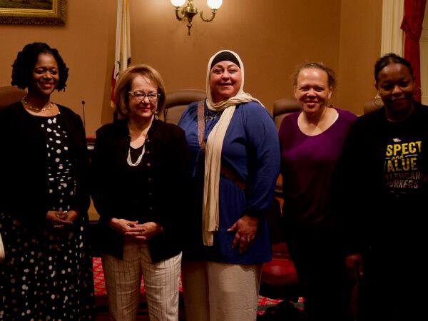 State Sens. Lola Smallwood-Cuevas and María Elena Durazo with supporters of Senate Bill 828 as seen after the bill passed the Senate's Labor, Public Employment, and Retirement Committee on May 29, 2024. (Travis Gillmore/The Epoch Times)