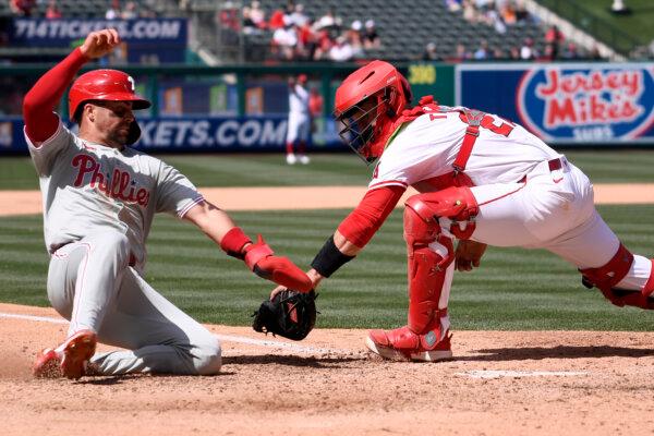 Angels catcher Matt Thaiss tags out the Phillies' Whit Merrifield at the plate in Anaheim, Calif., on May 1, 2024. (Alex Gallardo/AP Photo)