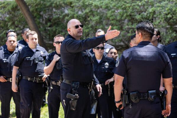 Police officers are deployed near a pro-Palestinian protest encampment on the campus of the University of California, Los Angeles (UCLA) in Los Angeles, on May 1, 2024. (Etienne Laurent/AFP via Getty)
