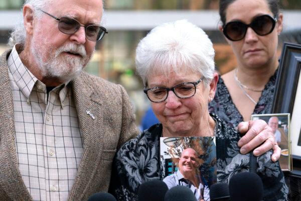 Kathleen and Clark Mcllvain whose son Charlie died in the dive boat fire breakdown while talking to the media in front of the U.S. Federal Building in downtown Los Angeles on May 2, 2024. (Richard Vogel/AP Photo)