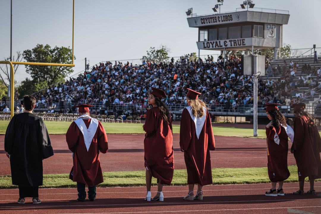 High school students line up for their graduation ceremony in Uvalde, Texas, on June 24, 2022. (Jordan Vonderhaar/Getty Images)