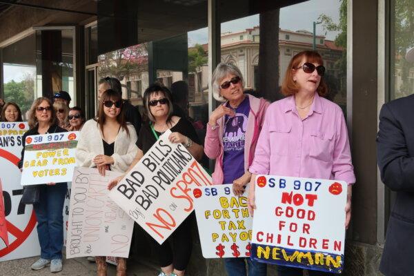 Community members attend a rally opposing SB 907, a bill that would expand the board of education from five to seven, in Fullerton, Calif., on May 3, 2024. (Sophie Li/The Epoch Times)