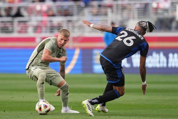 LAFC midfielder Mateusz Bogusz (19) dribbles the ball against San Jose Earthquakes defender Rodrigues (26) during the first half in San Jose, Calif., on May 4, 2024. (Darren Yamashita/USA TODAY Sports via Field Level Media)