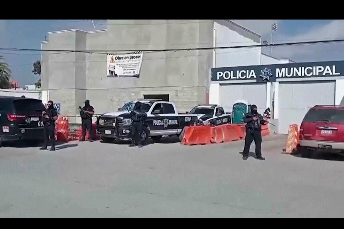 Mexico's police officers stand guard at the Ensenada station in Ensenada, Mexico, on May 2, 2024. (AP Photo)