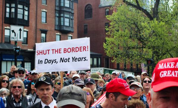 A crowd gathered in front of the Massachusetts statehouse to protest state and federal open border policies on May 4, 2024. (Alice Giordano/The Epoch Times)