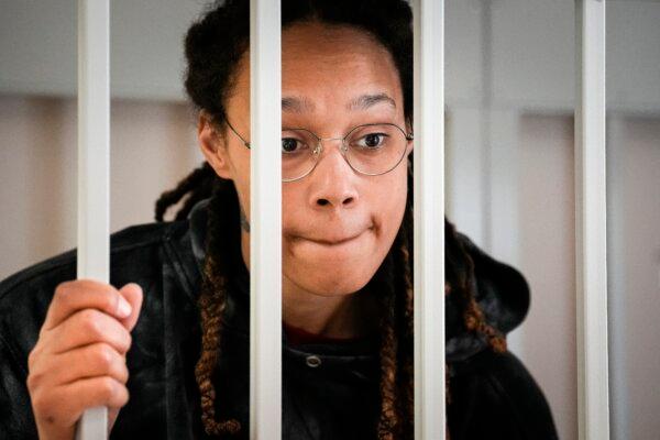 Brittney Griner speaks to her lawyers from inside a cage in a courtroom in Khimki, Russia, outside Moscow, on July 26, 2022. (Alexander Zemlianichenko/AP Photo)