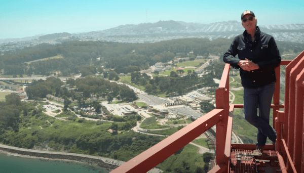 California Gov. Gavin Newsom announces the state's record levels of travel-related spending in 2023, on top of the Golden Gate Bridge in San Francisco on May 5, 2024. (YouTube/Screenshot via The Epoch Times)