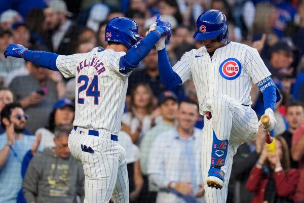 Cody Bellinger (L) celebrates his home run against the Padres with Cubs teammate Christopher Morel in Chicago on May 7, 2024 (Erin Hooley/AP Photo)