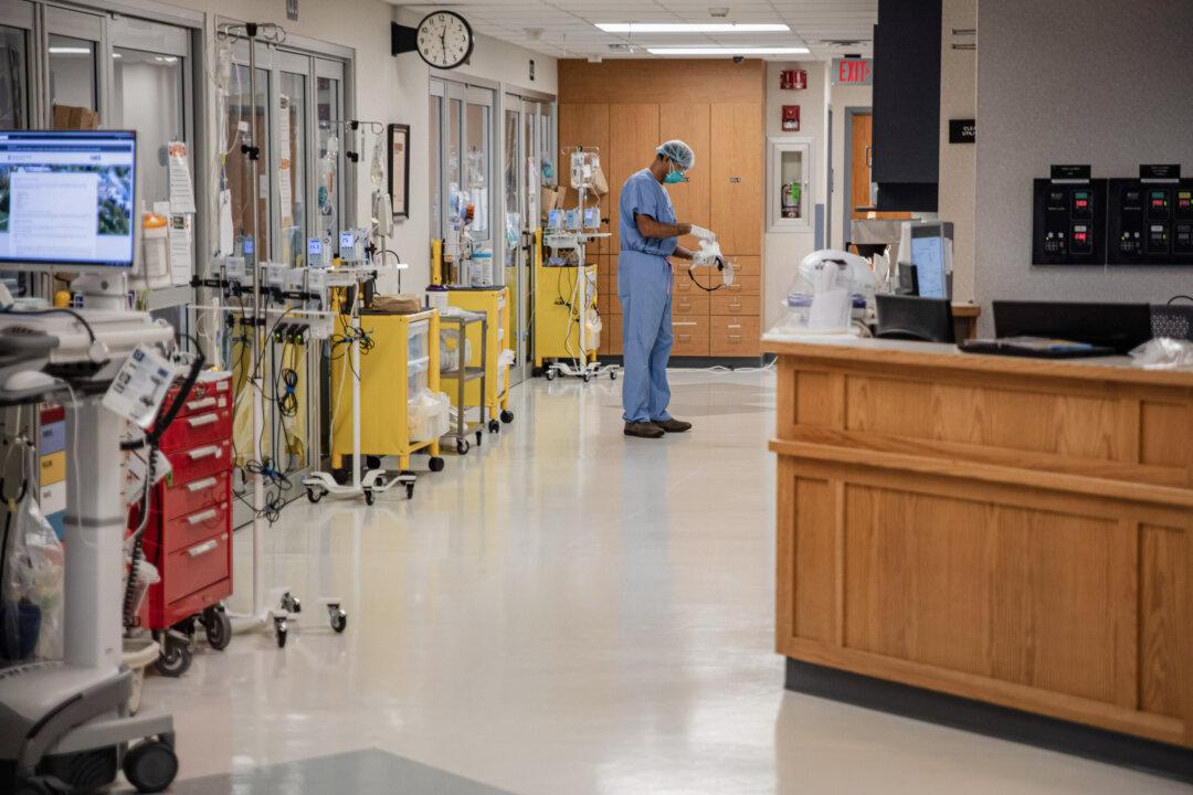 A health care professional suits up to enter a room in the ICU at Van Wert County Hospital in Van Wert, Ohio, on Nov. 20, 2020. (Megan Jelinger/AFP via Getty Images)