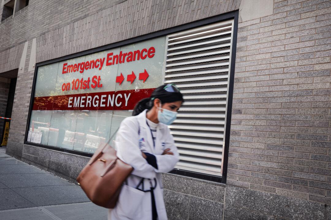 A person walks past an 'Emergency Entrance' sign at Mount Sinai Hospital in New York City on Sept. 22, 2020. (Spencer Platt/Getty Images)