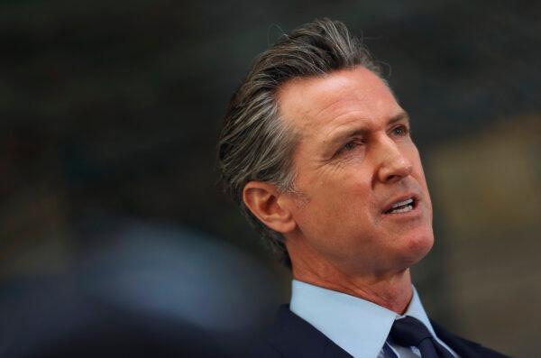 California Gov. Gavin Newsom looks on during a press conference at The Unity Council in Oakland, Calif., on May 10, 2021. (Justin Sullivan/Getty Images)