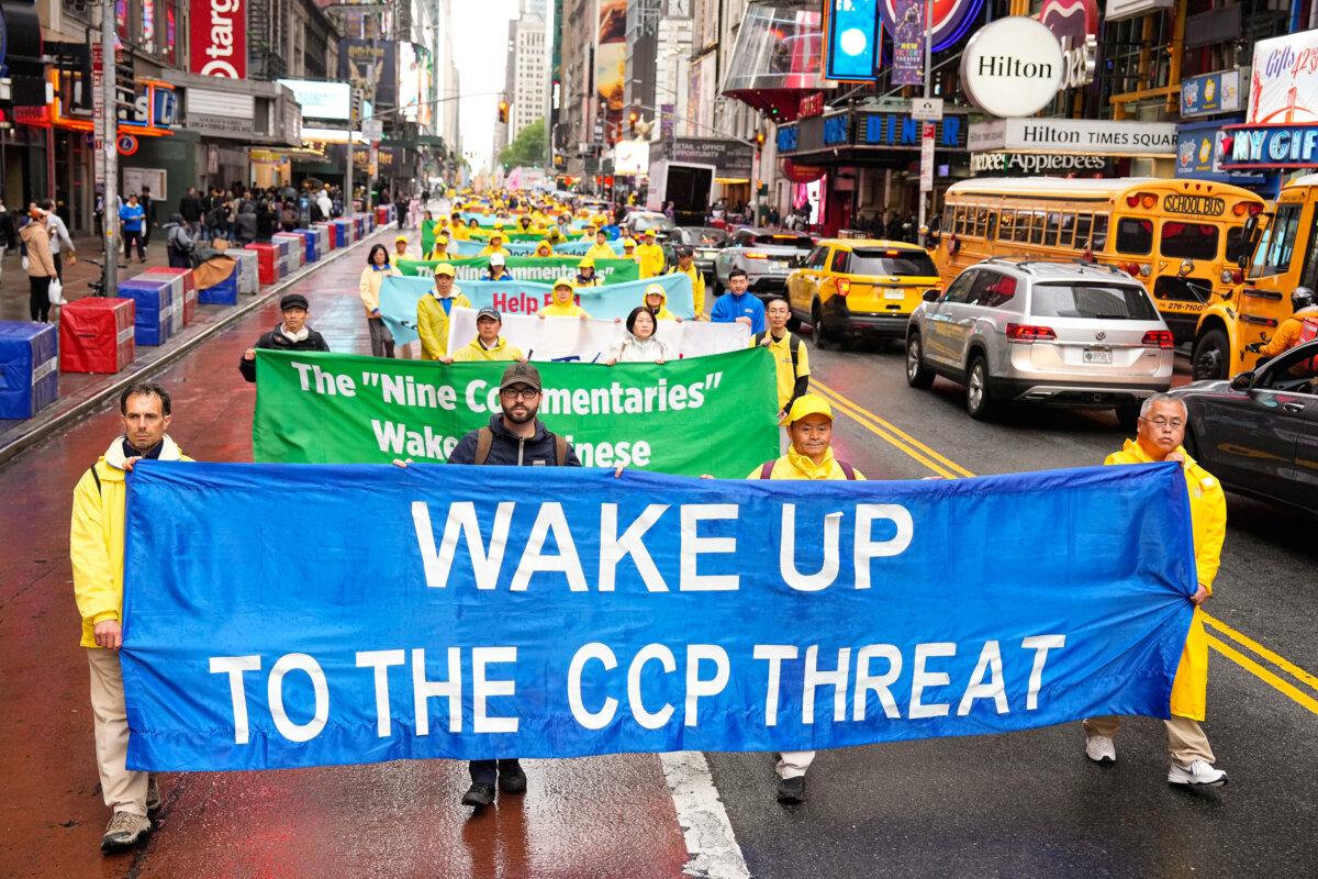 Falun Dafa practitioners take part in a parade to celebrate World Falun Dafa Day while calling for an end to the persecution in China, in New York City, on May 10, 2024. (Larry Dye/The Epoch Times)