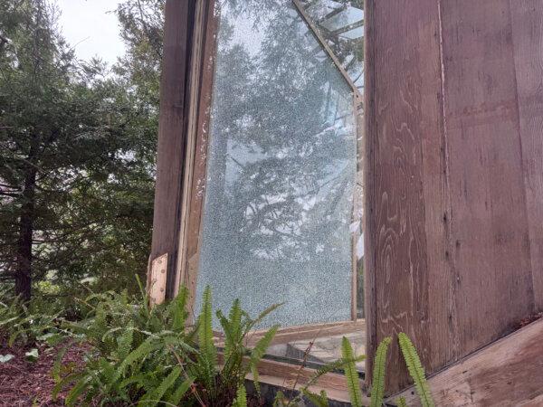 A shattered window at Wayfarers Chapel on May 13, 2024. (Rudy Blalock/The Epoch Times)